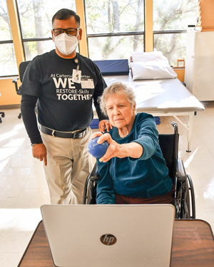 Therapist supervising RESTORE therapy session at Riverdale Center